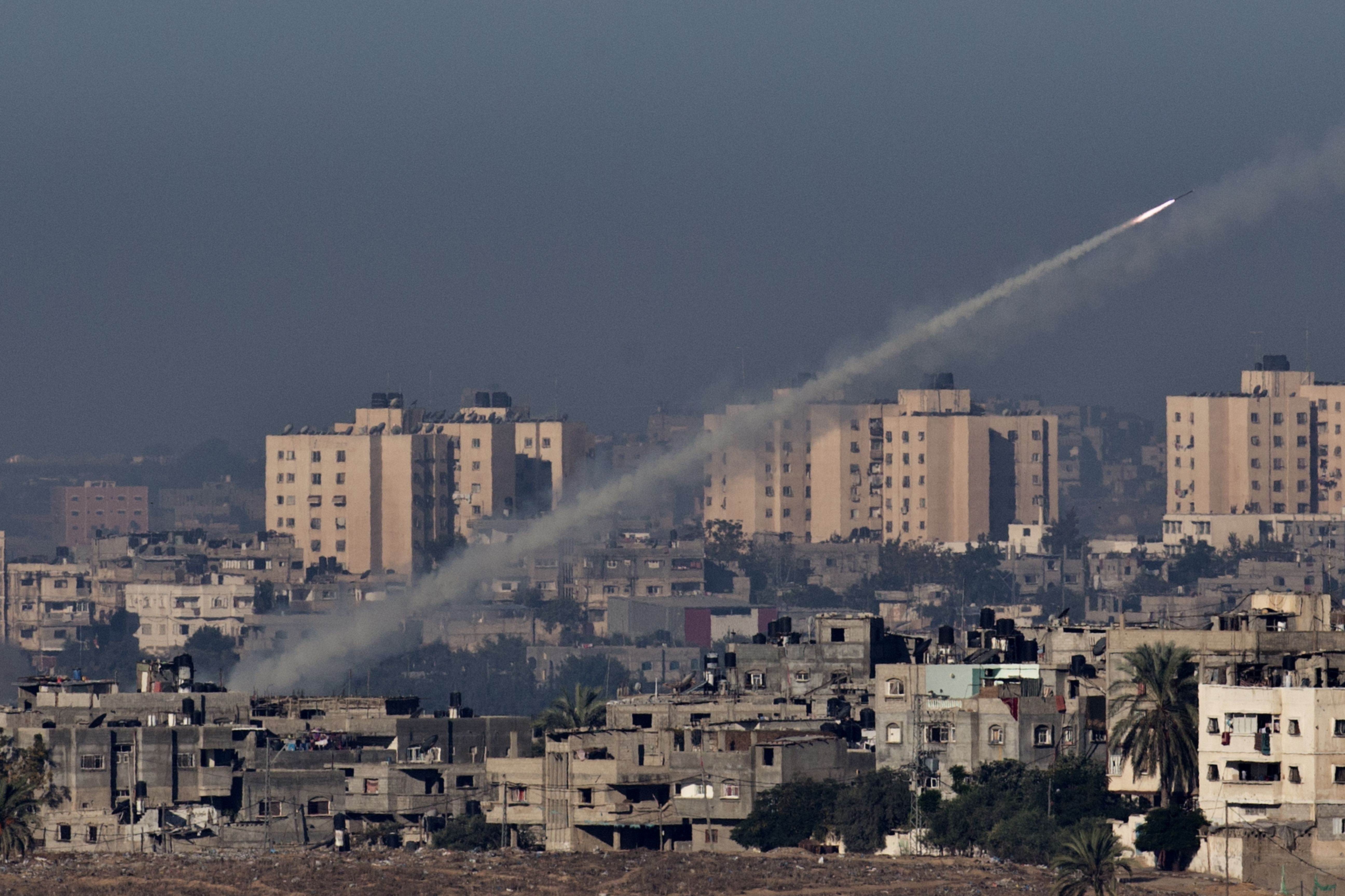 A picture taken from the southern Israeli town of Sderot shows a rocket being launched from the Gaza Strip into Israel on Thursday. Photo: AFP