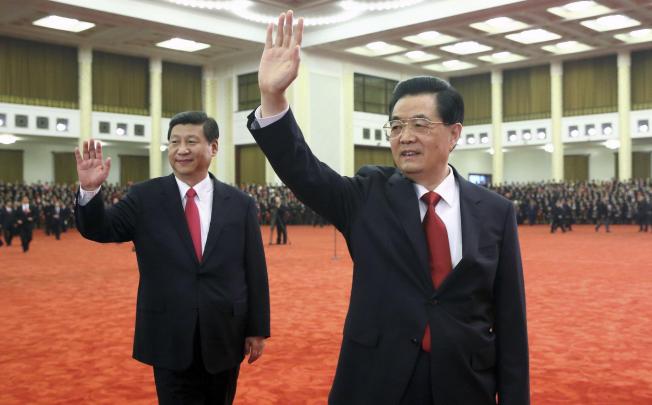 President Hu Jintao with Xi Jinping, his successor as party general secretary and chairman of the Central Military Commission, wave to congress delegates. Photo: Reuters