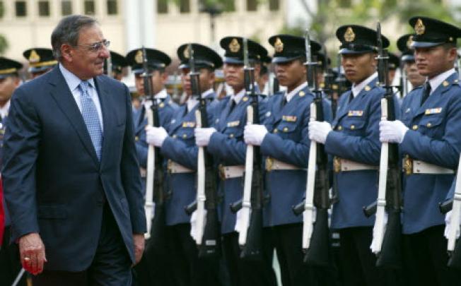 US Defence Secretary Leon Panetta (left) reviews an honour guard during a ceremony prior to a meeting Thai counterpart Sukampol Suwannathat in Bangkok on Friday. Photo: AP