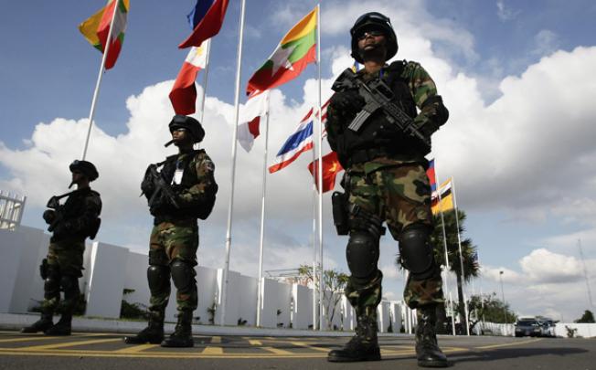Cambodian securities personnel stand guard at Phnom Penh International Airport ahead of the 21st of Association of Southeast Asian Nations Summit on Saturday. Photo: AP