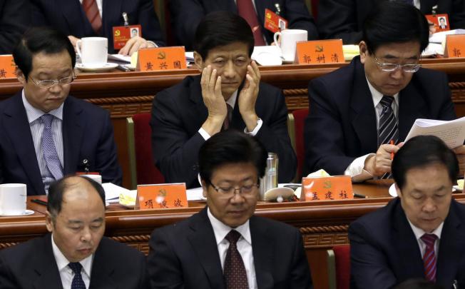 The appointment of Meng Jianzhu (top centre) as new security tsar has been welcomed by many as signalling the downgrading of the Communist Party's Political and Legal Affairs Commission. Photo: AP