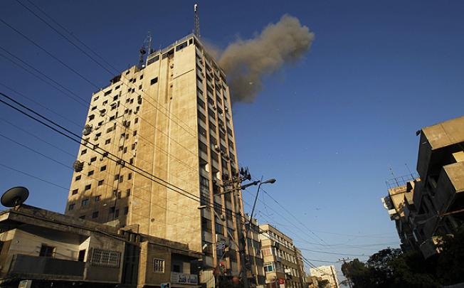 An Israeli air strike targets Hamas' television channel Al-Aqsa in Gaza. Photo: AFP
