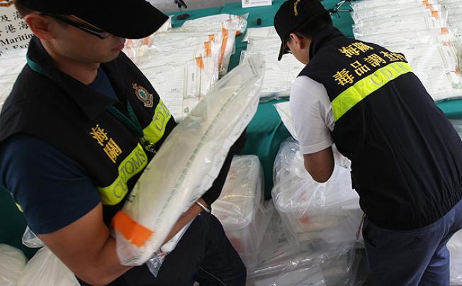 Customs officers show their biggest seizure of 412kg of ketamine with a street value of HK$47 million at its Kwai Chung Customhouse on June 1. Photo: David Wong