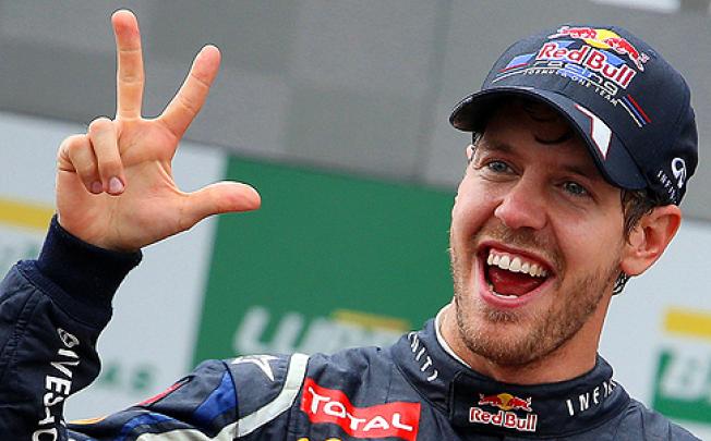 Sebastian Vettel became Formula One’s youngest triple world champion at the age of 25 on Sunday. Photo: EPA