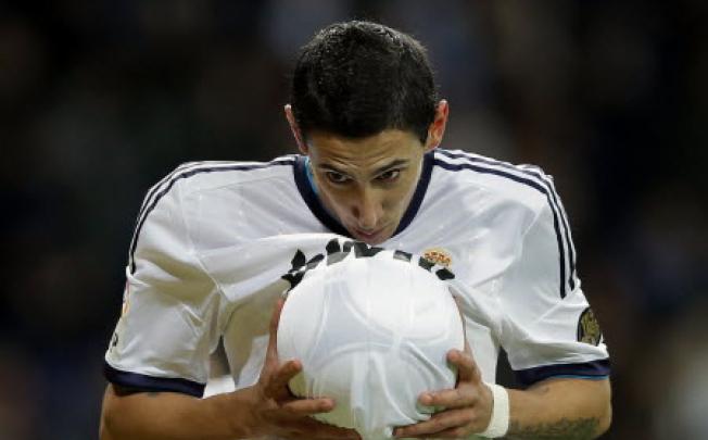 Real Madrid's Angel Di Maria from Argentina celebrates after scoring a goal against Alcoyano during a Copa del Rey soccer match at the Santiago Bernabeu stadium in Madrid on Tuesday. Photo: AP