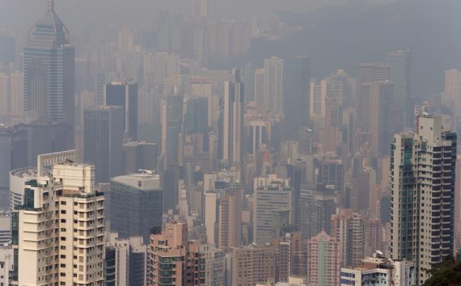 The Hong Kong skyline is hazed by smog. Pictured at The Peak. Photo: Sam Tsang