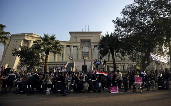 Hundreds of supporters of Egypt's President Mohamed Mursi protest outside the Supreme Constitutional Court in Cairo on Sunday. Photo: AFP