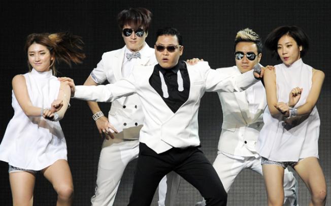 Psy (centre) performs with backup dancers during the second night of KIIS FM's Jingle Ball at Nokia Theatre LA Live on Monday in Los Angeles. Photo: AP