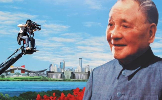 A billboard of former leader Deng Xiaoping overlooks Shenzhen. Photo: Dickson Lee