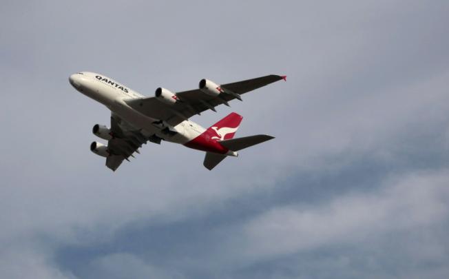 A Qantas A380 takes off from Sydney airport. AIG has moved a step closer to refocusing on its core insurance business with a deal selling up to 90 per cent of its ILFC aircraft leasing business to a Chinese consortium. Photo: Bloomberg