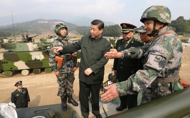 Xi Jinping examines a vehicle in Guangzhou. Photo: Xinhua