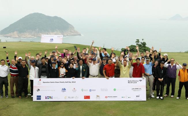 Players cheer their fund-raising efforts at the BAML charity golf day at Clearwater Bay Golf Club. Photo: Edward Wong