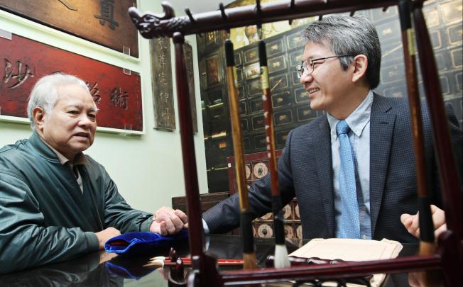 Professor Bian Zhaoxiang (right), of Baptist University's School of Chinese Medicine, helps the elderly cope with chronic illness. Photo: May Tse