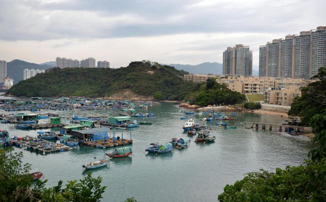 Ma Wan's dwindling fish farms today are overlooked by Park Island, a private housing estate. Photo: Thomas Yau