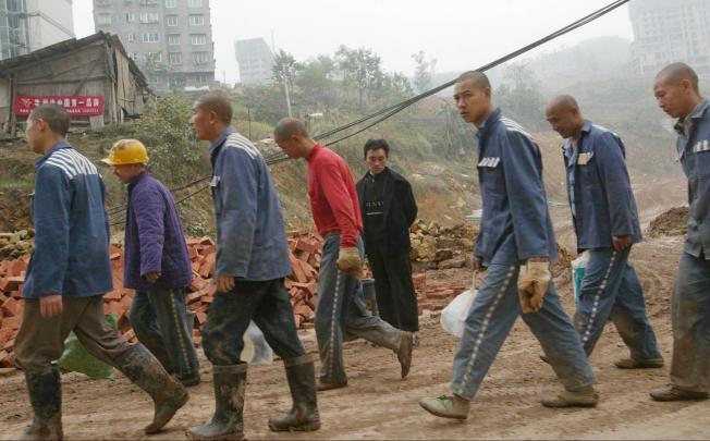 Prisoners used for manual labour near the city of Chongqing. Photo: Mark Ralston
