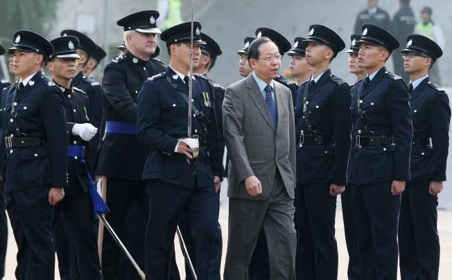 Secretary for Security Lai Tung-kwok reviews the police passing-out parade yesterday. Photo: K. Y. Cheng