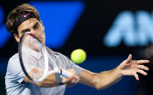 Roger Federer of Switzerland up against Milos Raonic of Canada at 2013 Australian Open tennis tournament in Melbourne. Photo: Xinhua