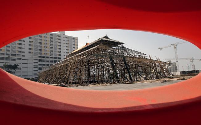 Workers work on the Bamboo Theatre at West Kowloon Cultural District. Photo: Edward Wong