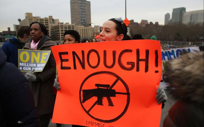 Gun control activists march across Brooklyn Bridge. Photo: AFP
