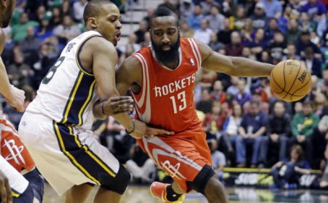 Houston Rockets' James Harden (13) drives around Utah Jazz's Randy Foye (8) during the second quarter of an NBA basketball game. Photo: AP