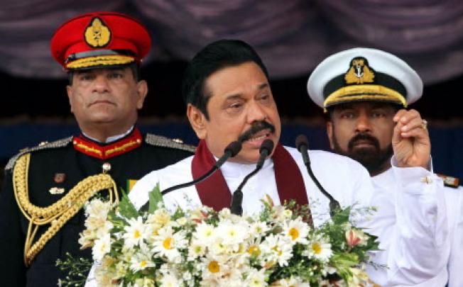 Sri Lankan President Media Division shows Sri Lankan President Mahinda Rajapaksa (centre) addressing the nation. Photo: EPA