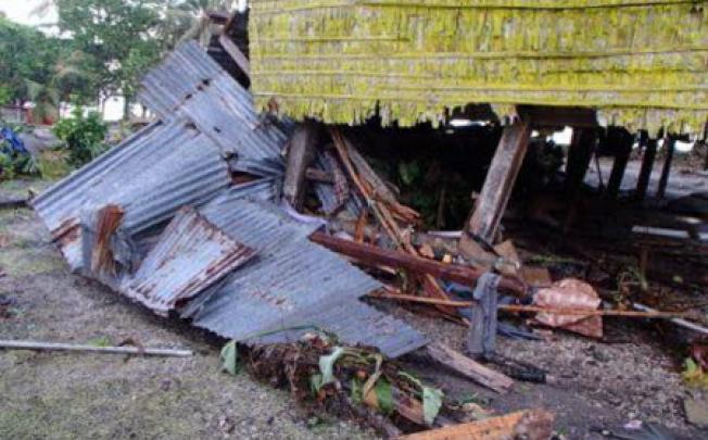 Damage to homes in the village of Louva, caused by a tsunami in the Santa Cruz Islands region of the Solomons Islands. Photo: AFP