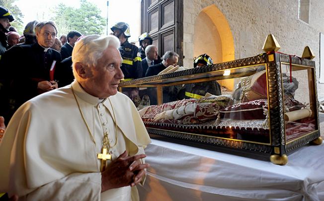 Pope Benedict XVI stands beside the relic of Pope Celestine V in the church St Maria of Collemaggio after the earthquake in L'Aquila in 2009. Photo: Reuters