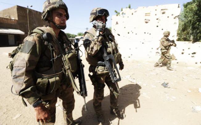 French soldiers holding F1 assault rifles patrol in Gao, Mali. Photo: AFP