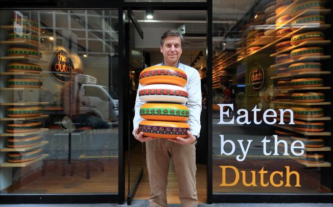 Wheels of fortune: Nick Pauli of The Dutch Cheese and More at his shop in Sheung Wan. Photo: Jonathan Wong