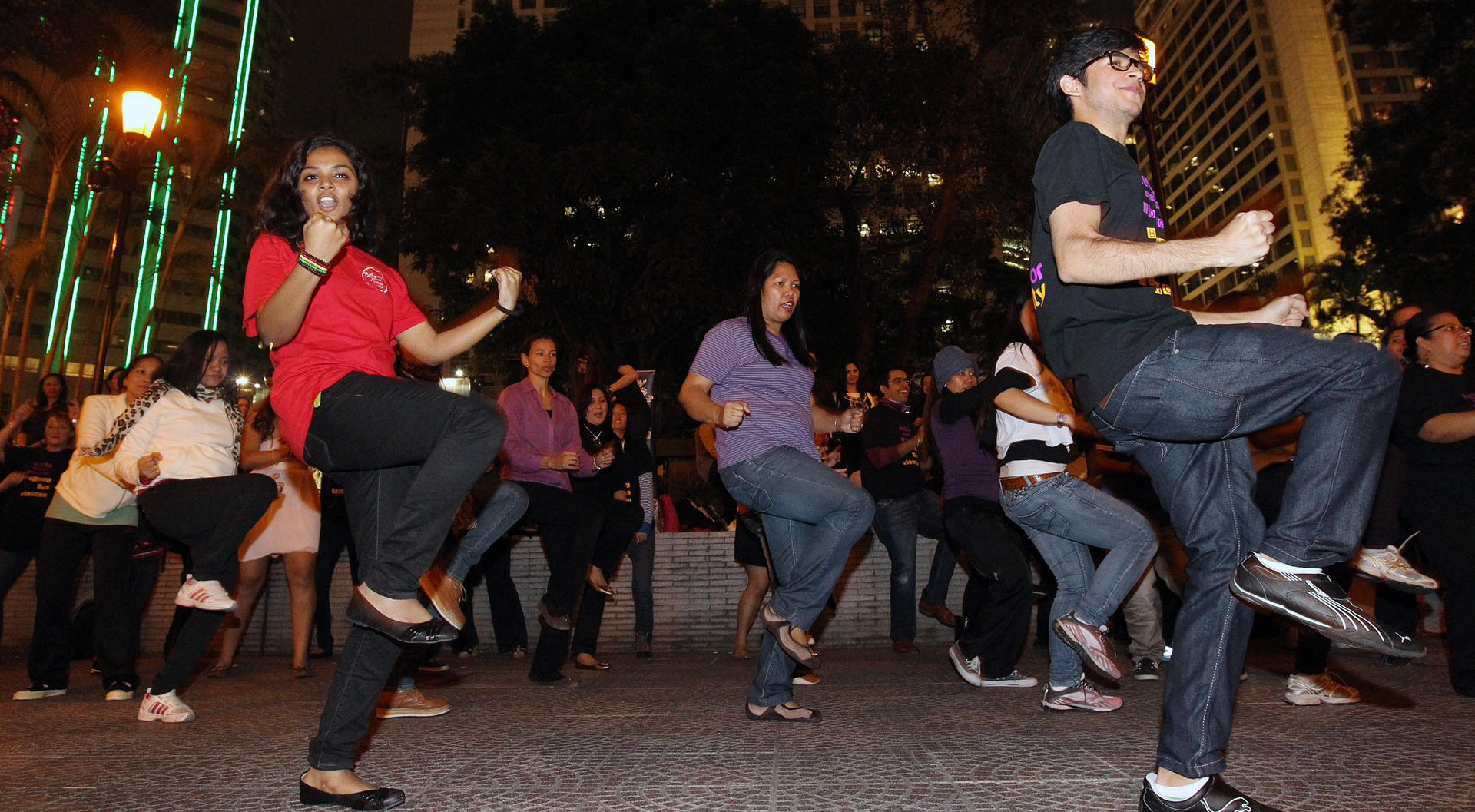 People do the Break the Chain dance at Chater Garden, Central.
