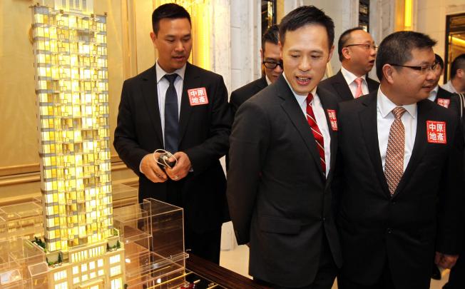 Victor Tin (2nd from left), associate director of Sino Land says the firm will offer an initial batch of 30 flats at The Avery in the first stage. Photo: Dickson Lee