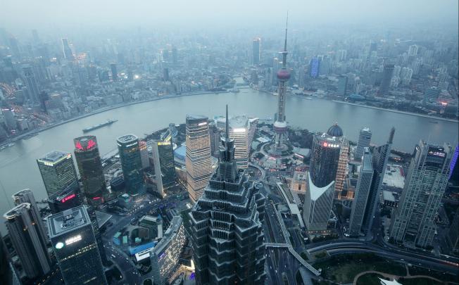 The height of Shanghai's towers may keep climbing forever, but not so home prices. Photo: Bloomberg