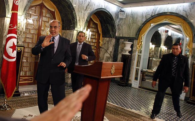 Tunisia's Prime Minister Hamadi Jebali gestures as he leaves after announcing his resignation during a news conference in Tunis. Photo: Reuters