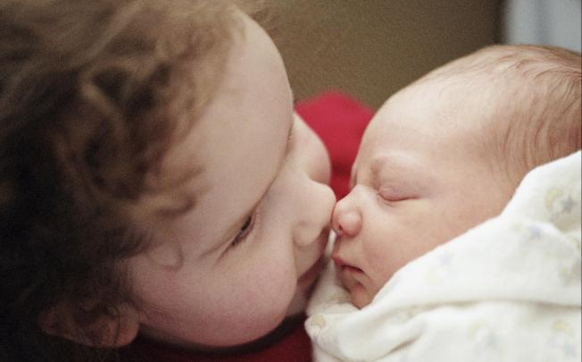 Making a new older sibling feel important is crucial. Photo: Jesse Reardon