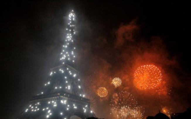 Fireworks burst over the Eiffel Tower in Paris. Photo: AFP
