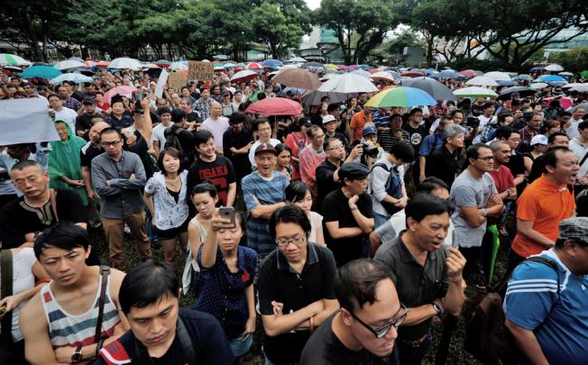 A protest against an immigration plan that could see Singapore population increase 30 per cent by 2030. Photo: EPA