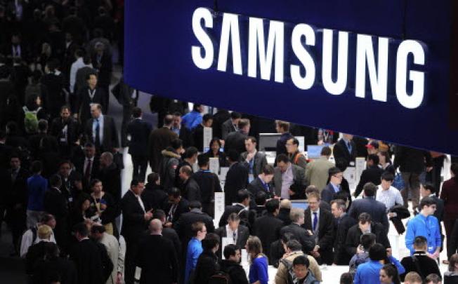 People visit a Samsung stand in Barcelona  on the second day of the 2013 Mobile World Congress. Photo: AFP