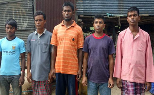 Rohingyan men who managed to swim to take refuge in a Muslim village in Phuket. Photo: Phuketwan