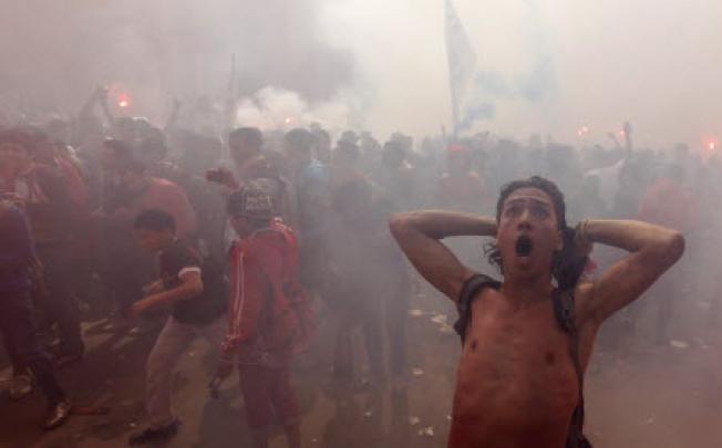 Al-Ahly fans celebrate and shout slogans after hearing final verdict of Port Said massacre in Cairo. Photo: Reuters