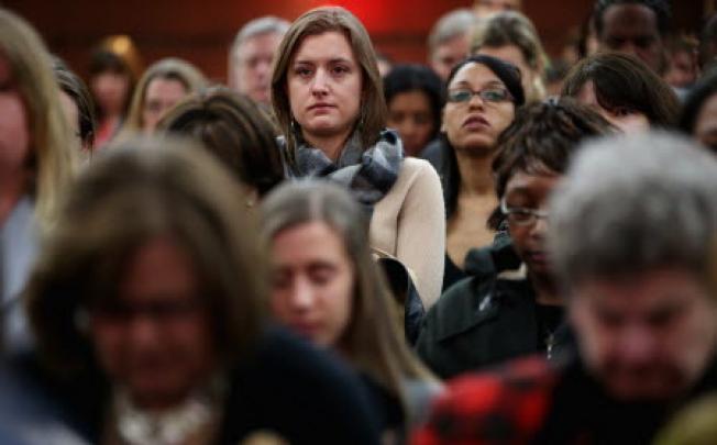 People stand for a moment of silence for the 23-year-old Indian woman known only as "Nirbhaya" at the International Women of Courage awards ceremony. Photo: AFP 