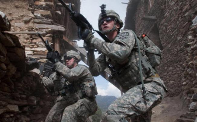 US troops on patrol in Afghanistan. Five Nato troops have died in a helicopter crash in the troubled region. Photo: AP
