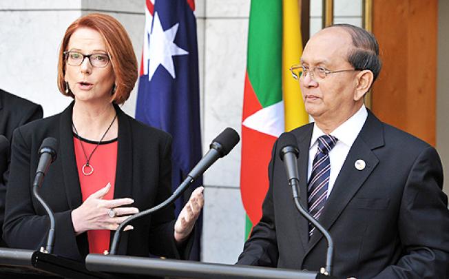 Prime Minister Julia Gillard (left) and the President of Myanmar Thein Sein speak to the press at Parliament House in Canberra on Monday. Photo: AFP