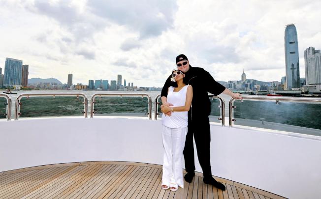 Kim Dotcom with his wife, Mona Verga, in Victoria Harbour. The couple met in Manila, after he moved to Hong Kong in 2003. Photo: Kim.com