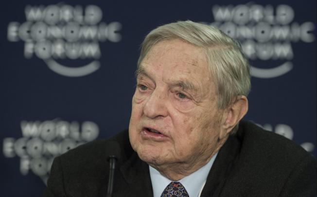 Billionaire investor George Soros speaks at the World Economic Forum in Davos. Photo: EPA