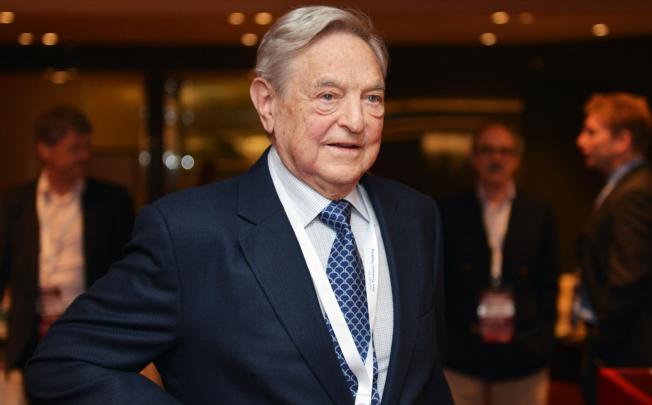 George Soros attends a forum in Hong Kong. Photo: Thomas Yau