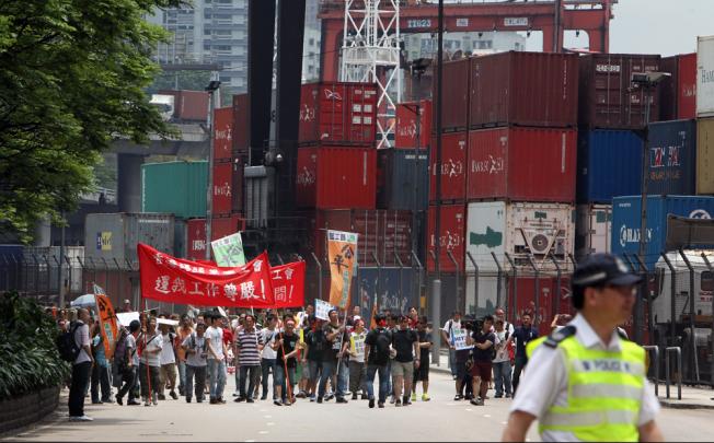 Striking dock workers stage a protest outside Kwai Chung Container Terminal. Photo: Felix Wong