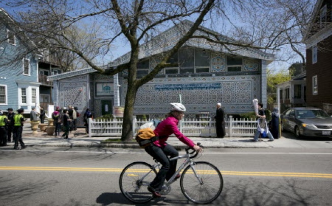 A bicyclist rides by the Islamic Society of Boston mosque in Cambridge.Photo: AP