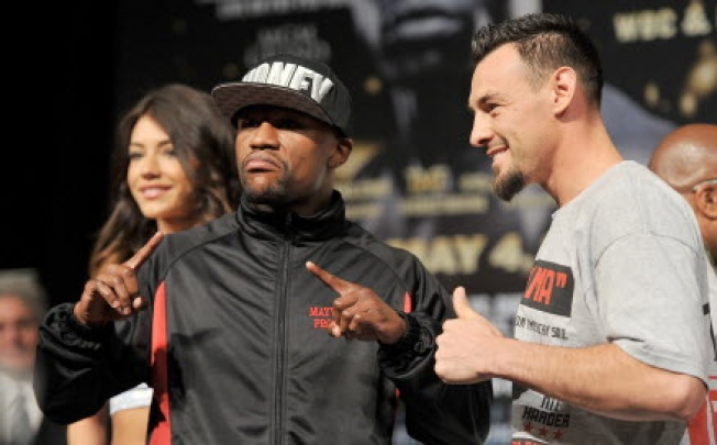Boxers Floyd Mayweather Jr. (L) and Robert Guerrero pose during the final news conference for their bout at the MGM Grand Hotel/Casino in Las Vegas. Photo: AFP