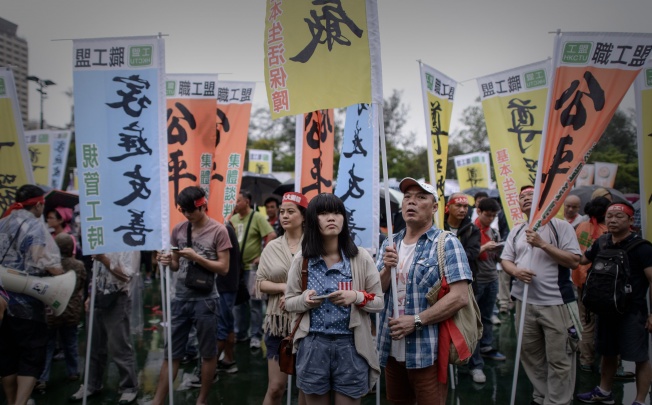 Workers take part in a Labour Day rally in Hong Kong on May 1, 2013. Photo: AFP