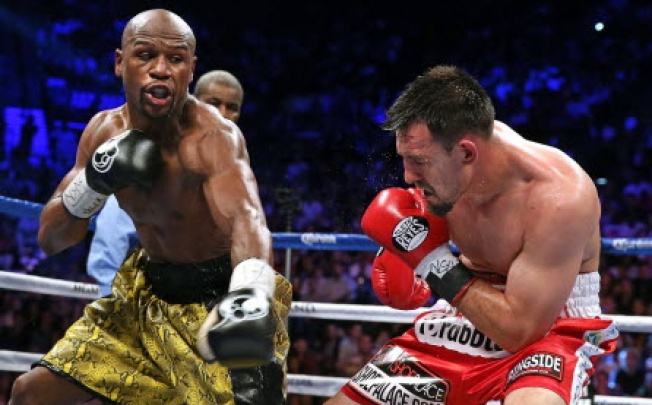 World Boxing Council champion Floyd Mayweather (left) and Robert Guerrero (right) exchange punches during their fight at the MGM Grand Garden Arena in Las Vegas on May 4. Photo: AFP